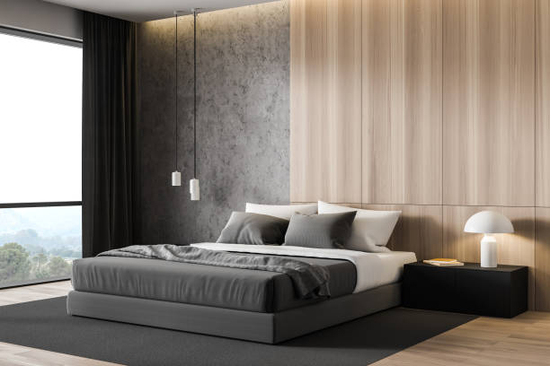 istock Wooden and concrete master bedroom corner 1219892033