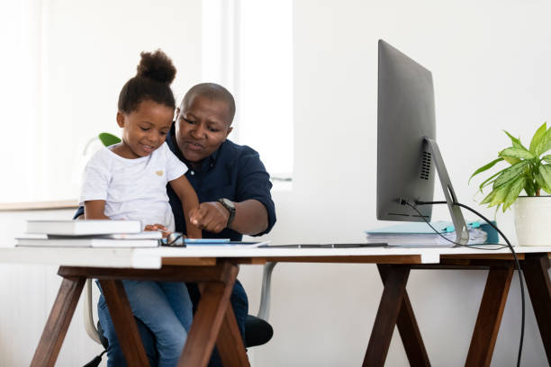 istock Mother working at home while homeschooling daughter using digital tablet 1219893300