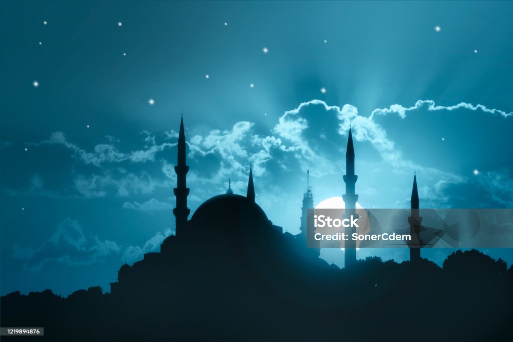 A silhouette of a big mosque on Blue full moon in night background. Ramadan concept. A silhouette of a big mosque on Blue full moon in night background. Ramadan concept Mosque Stock Photo