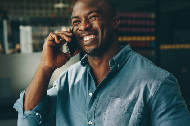 istock Businessman talking over mobile phone in office 1219897813