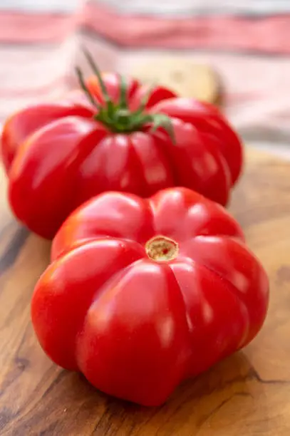 Two sweet pink monterosa tomatoes close up