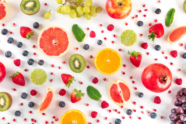 istock Fresh summer fruit, a flat lay on a white background, vibrant food pattern, overhead shot 1219898934