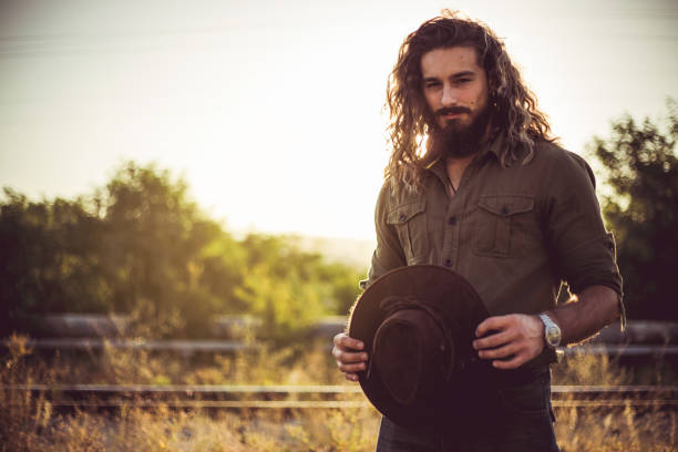 Wild west before dawn. The cowboy is getting ready for morning activities, sunrise