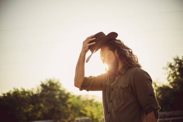 Wild west before dawn. The cowboy is getting ready for morning activities, sunrise