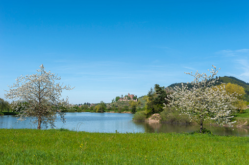 Ortenberg, Germany - April 19, 2015: Lake Moeschlesee with a view of Ortenberg Castle