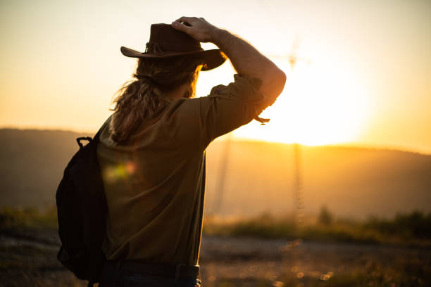 Wild west before dawn. The cowboy is getting ready for morning activities, sunrise