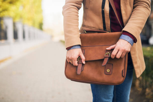 istock Close up of a businessman holding a briefcase. 1219903979