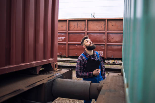 istock Railroad inspector checking freight train at the station. 1219904004