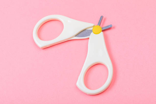 istock safe scissors for babies on pastel pink background - Image 1219904156