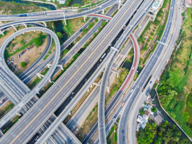 istock Aerial view elevated city road junction and interchange overpass at  day light 1219908177