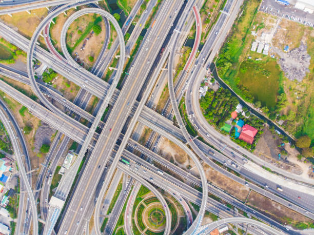 istock Aerial view elevated city road junction and interchange overpass at  day light 1219908180