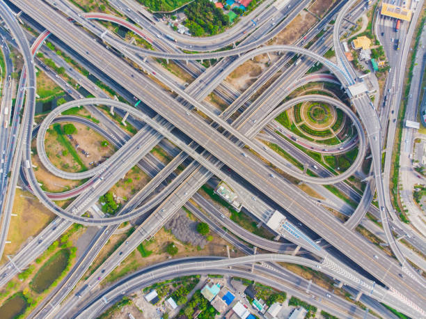 istock Aerial view elevated city road junction and interchange overpass at  day light 1219908203
