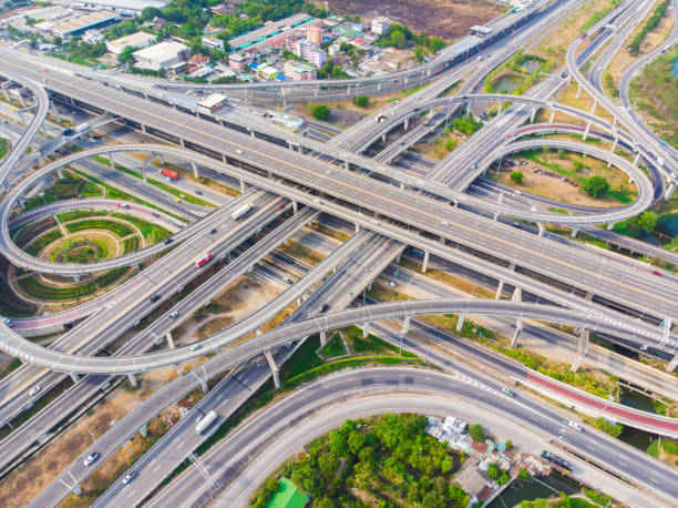 istock Aerial view elevated city road junction and interchange overpass at  day light 1219908261