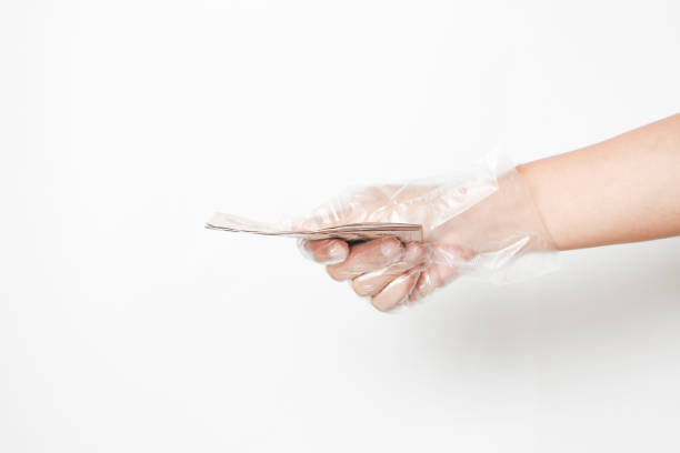 istock hand in plastic gloves.  To prevent corona virus. 1219911547