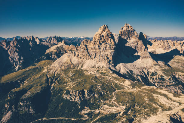Aerial view of Italian alps - Drei Zinnen (Tre Cime di Lavaredo). Mountains in a sunny autumn day.