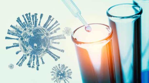 istock Close up pipette dropping blue solution sample into test tube in laboratory with Coronavirus researching. Science researching and nanotechnology biology concept. Virus and illness treatment background 1219912738