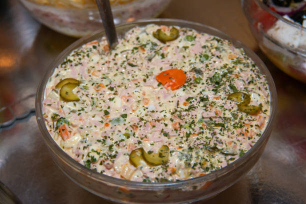 Russian salad in bowl close up