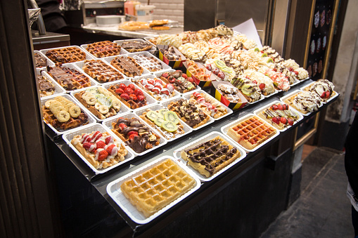 Various choice of delicious Belgian waffles on the street