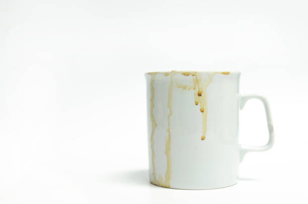istock Dirty water glass, coffee cup, coffee stains on white background 1219916604