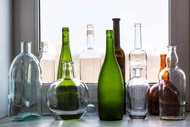 Artistic hand-made glass vase on the table in glass blowing factory