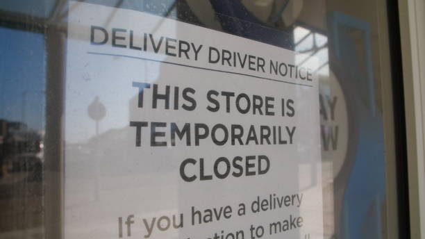 istock Closed sign in window due to Coronavirus pandemic 1219917308