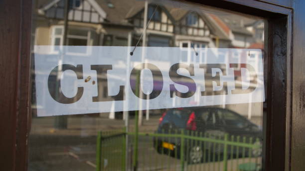 istock Closed sign in window due to Coronavirus pandemic 1219917316