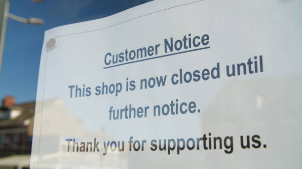 istock Closed sign in window due to Coronavirus pandemic 1219917324