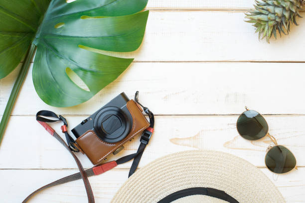 istock Summer accessories on white wooden  background 1219917752