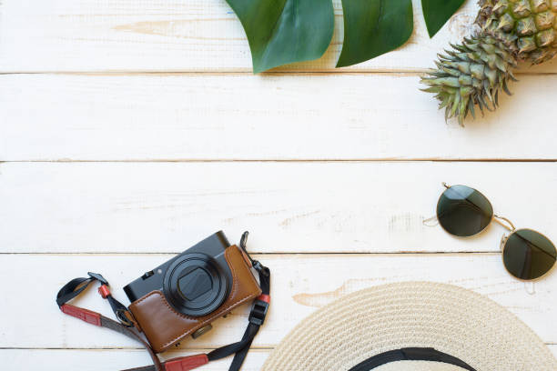 istock Summer accessories on white wooden  background 1219917765