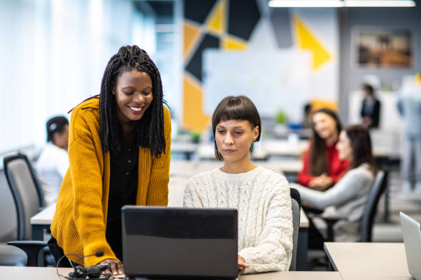istock Positive and productive coworkers at open space workplace 1219917826