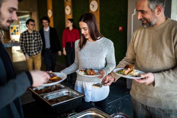 istock Colleagues serving themselves at buffet after work at self service restaurant 1219917876