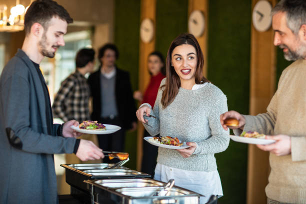 istock Colleagues choosing food during lunch break at self service restaurant 1219918118