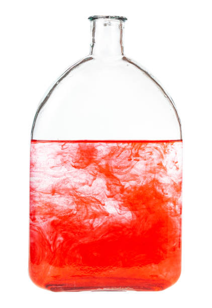 istock red dye dissolves in water in bottle isolated 1219919276