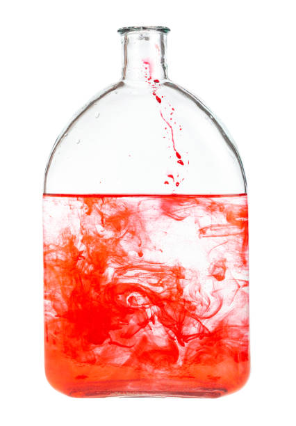 istock red dye dissolves in water in glass flask isolated 1219919280