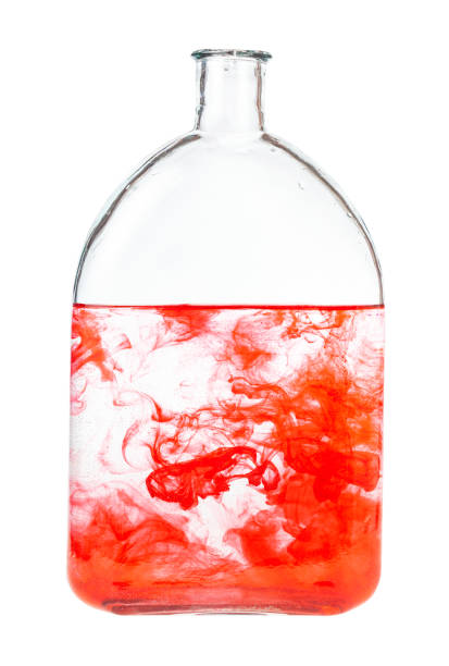 istock red watercolour dissolves in water in bottle 1219919284