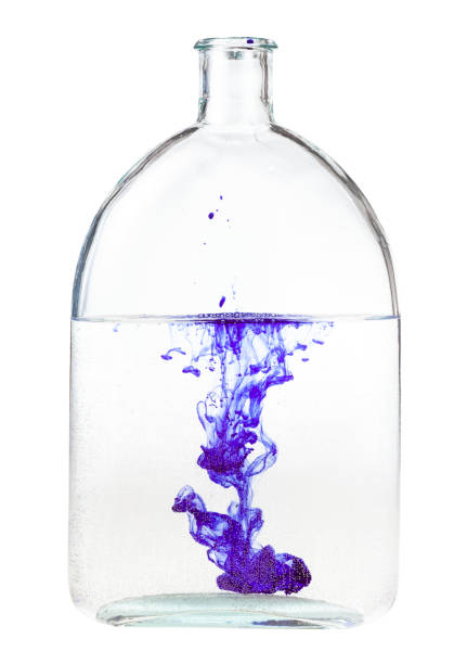 istock violet ink dissolves in water in bottle isolated 1219919297