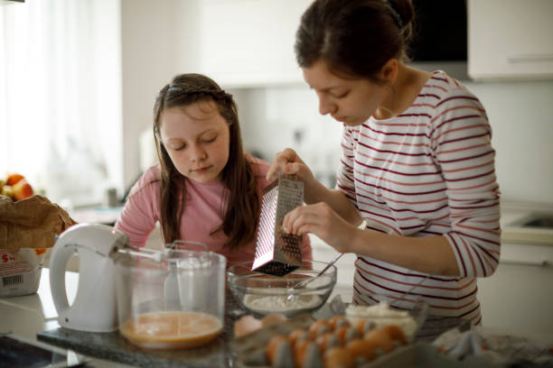 istock Sisters cooking together at home 1219920285