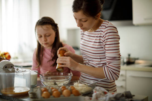istock Sisters cooking together at home 1219920535