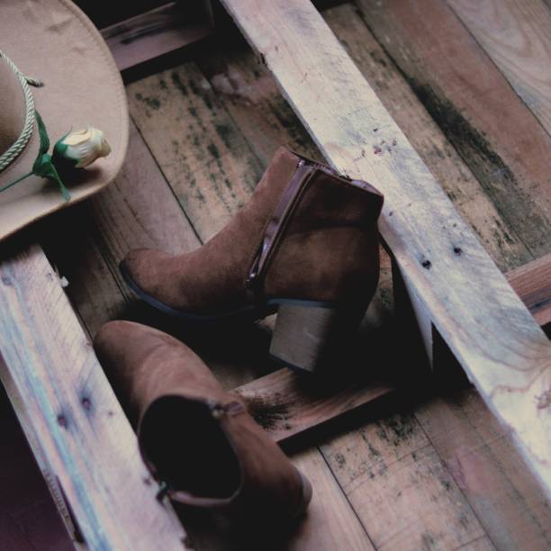 istock Cowboy hat hat boots ankle boots country 1219923519