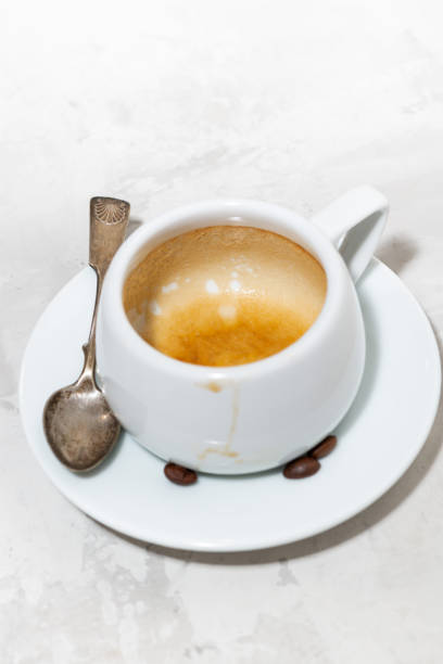istock empty cup of coffee on a white background, verical 1219923655