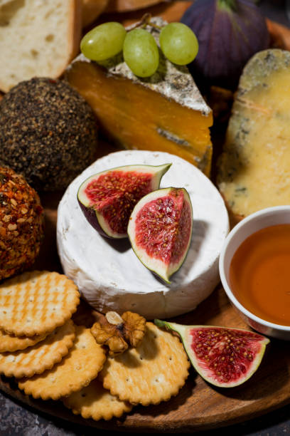 cheese, crackers and fruits, delicious snacks, vertical top view