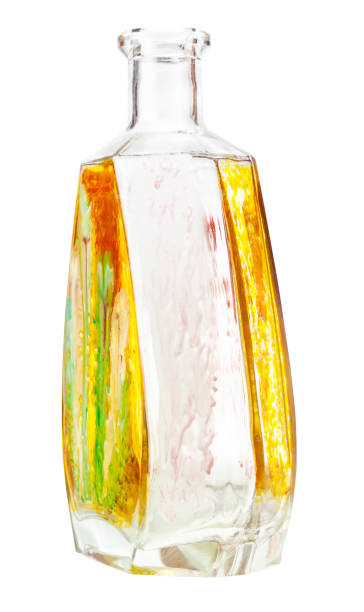 istock handpainted glass brandy bottle isolated on white 1219924963