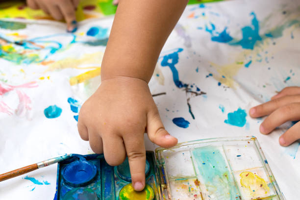 istock Child paint with watercolors. Education concept. 1219925010