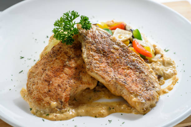 istock Pan fried chicken breast with mix vegetables 1219925503
