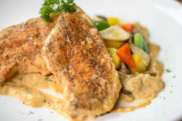 istock Pan fried chicken breast with mix vegetables 1219925596