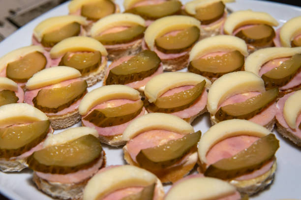 istock Baguette canapes with cheese, ham and pickles 1219925629