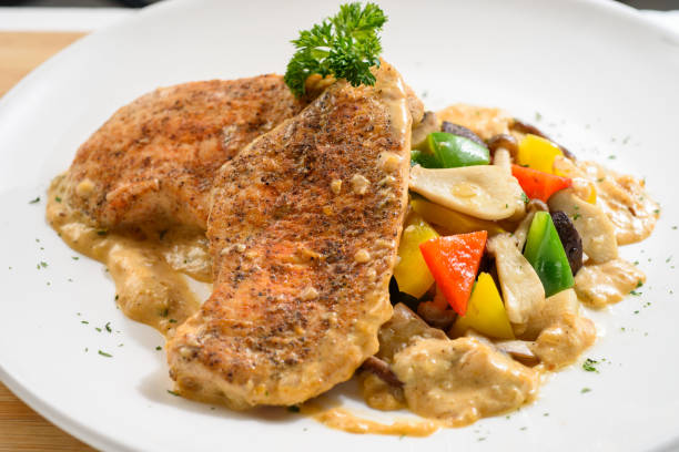istock Pan fried chicken breast with mix vegetables 1219925738