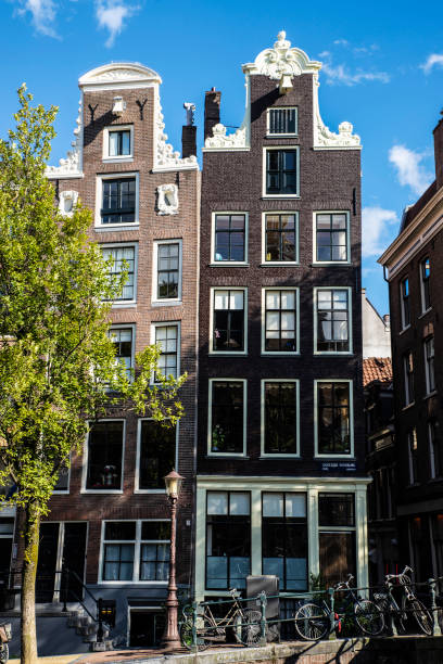 istock Old traditional leaning houses in Amsterdam, Netherlands 1219925981