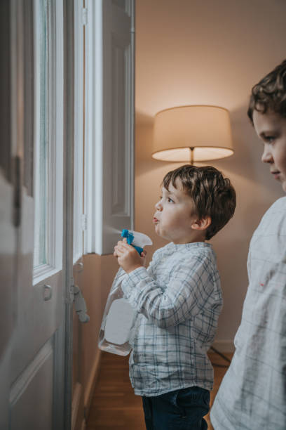 istock Boys cleaning windows during the Covid-19 quarantine 1219926789