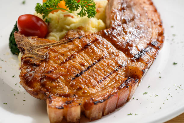 Grilled pork chop with mash potato and dressing
